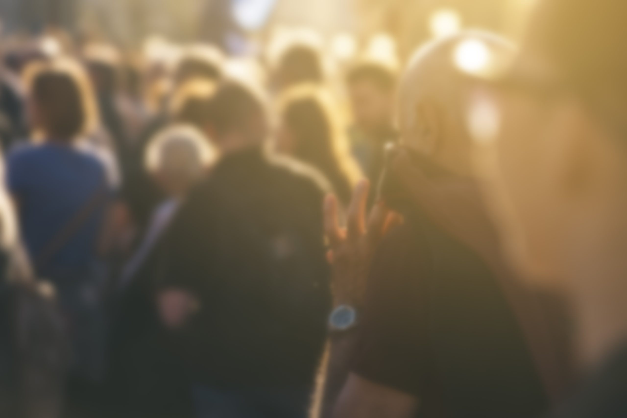 Defocused crowd attending political meeting